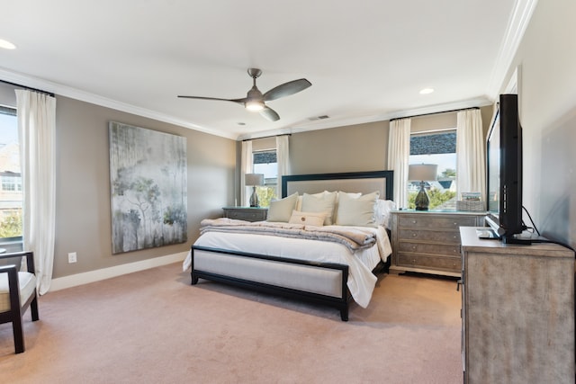 bedroom featuring ornamental molding, light carpet, and ceiling fan