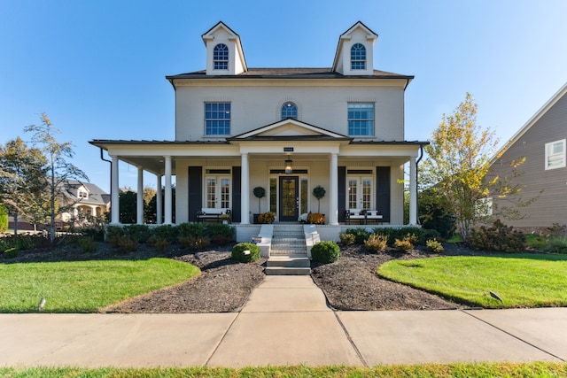 view of front of house with a front lawn and a porch