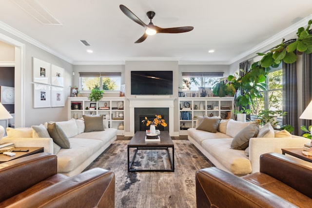 living room featuring ceiling fan and ornamental molding