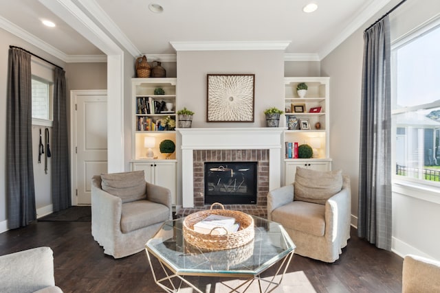 living room featuring ornamental molding, a brick fireplace, and dark hardwood / wood-style floors