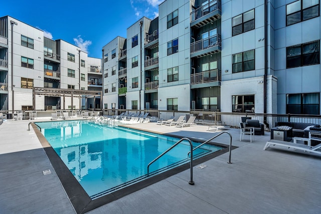 view of swimming pool featuring a patio area