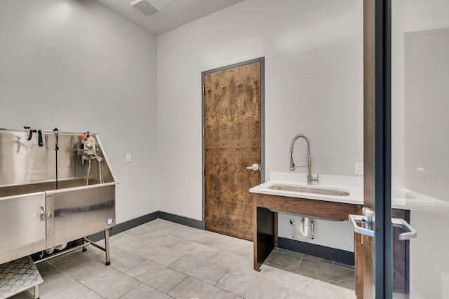 bathroom with sink and tile patterned floors