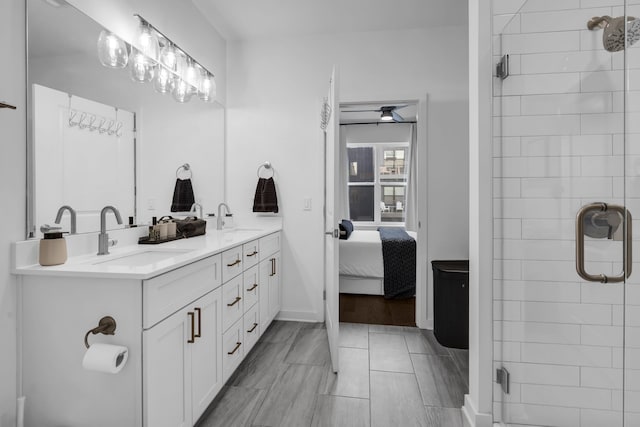 bathroom featuring vanity, a shower with shower door, and hardwood / wood-style flooring