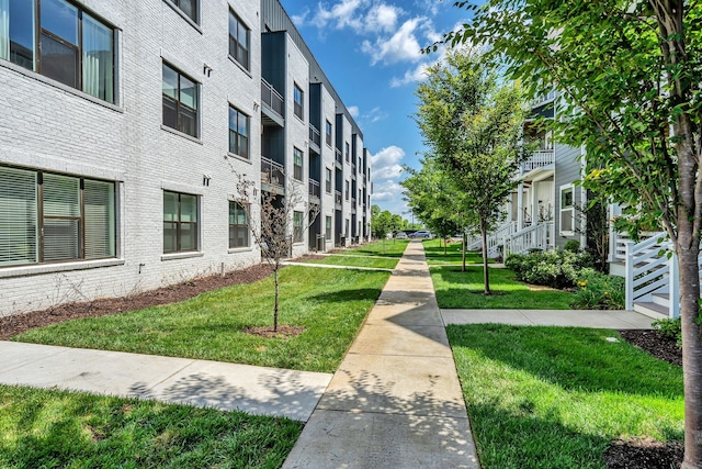 surrounding community featuring a yard