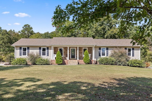 ranch-style home featuring a front yard