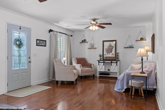 interior space with dark hardwood / wood-style floors, a healthy amount of sunlight, and ceiling fan