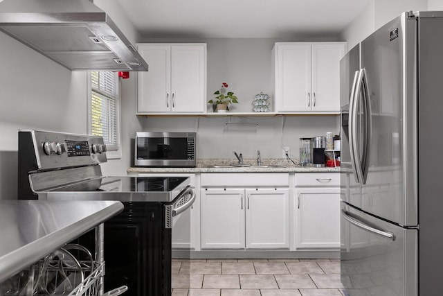 1529 Springvale Rd, Chattanooga, TN 37412 - kitchen with appliances with stainless steel finishes, range hood, white cabinetry, light tile patterned floors, and open shelves