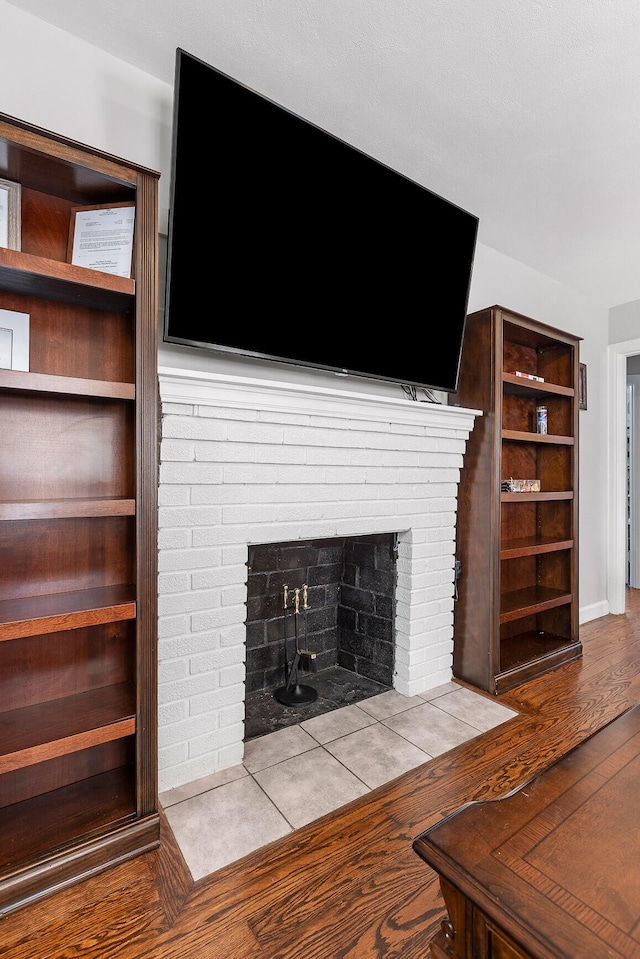 unfurnished living room featuring a fireplace and light wood-type flooring