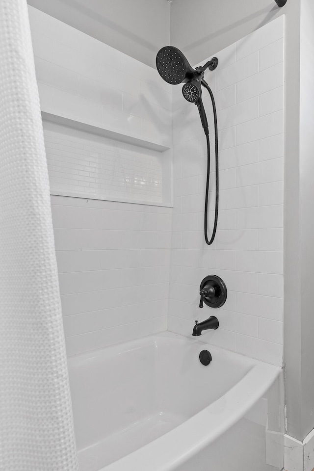 bathroom featuring shower / bathtub combination with curtain