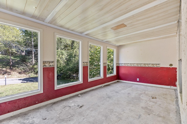 unfurnished sunroom with wooden ceiling