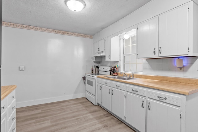 kitchen featuring light hardwood / wood-style flooring, sink, white range with electric cooktop, white cabinets, and premium range hood