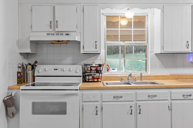 kitchen featuring sink, premium range hood, white electric range, and white cabinets