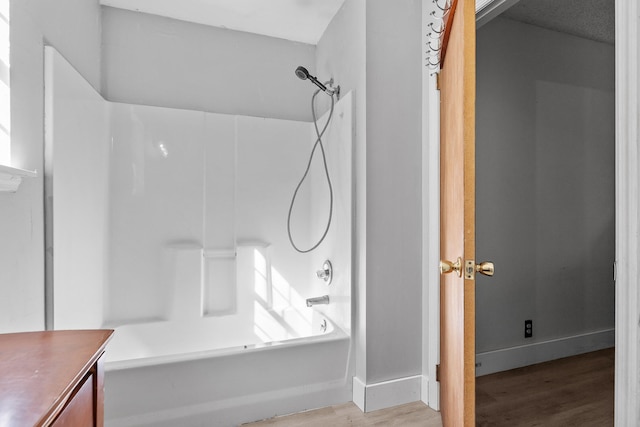 bathroom with vanity, shower / washtub combination, and wood-type flooring