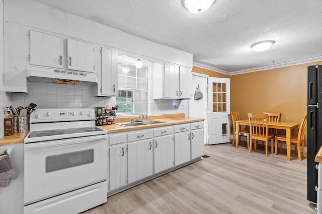 kitchen with white cabinetry, white electric range, sink, and light hardwood / wood-style floors