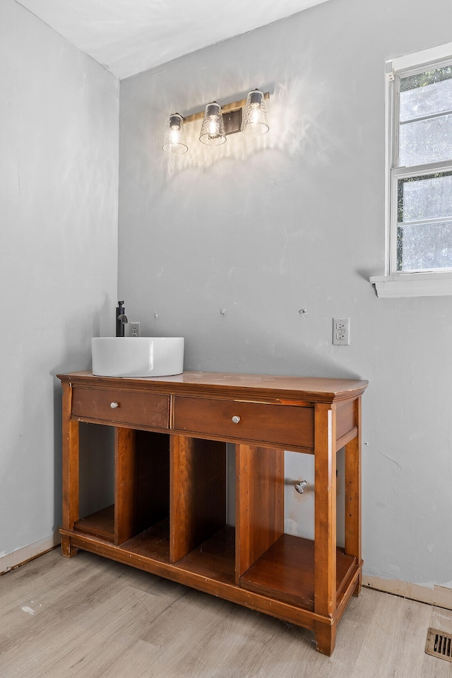 bathroom featuring vanity and hardwood / wood-style floors