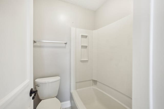 bathroom featuring plus walk in shower and toilet