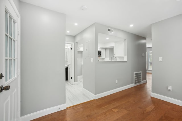 interior space with wood-type flooring and sink