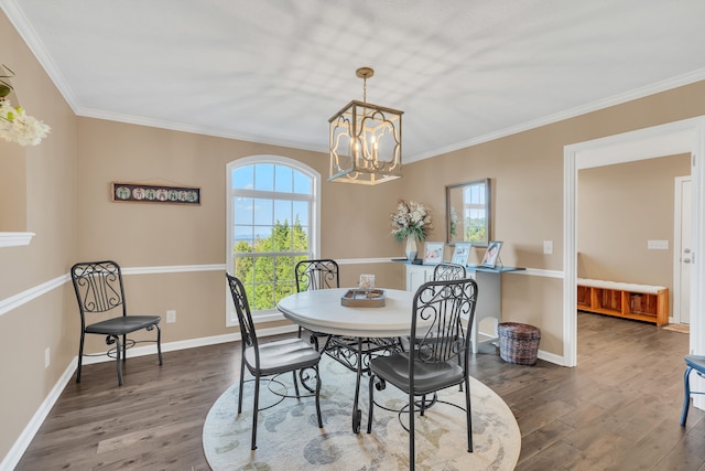 dining space featuring a wealth of natural light, ornamental molding, and dark hardwood / wood-style floors