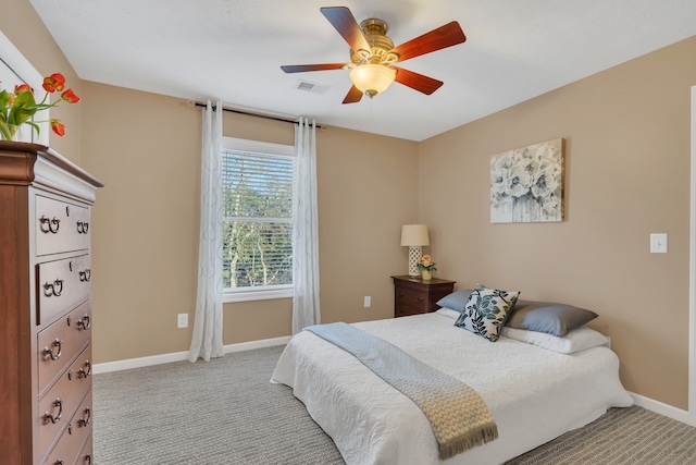 bedroom with ceiling fan and light colored carpet