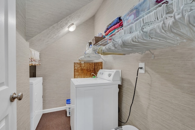 laundry room with washing machine and clothes dryer