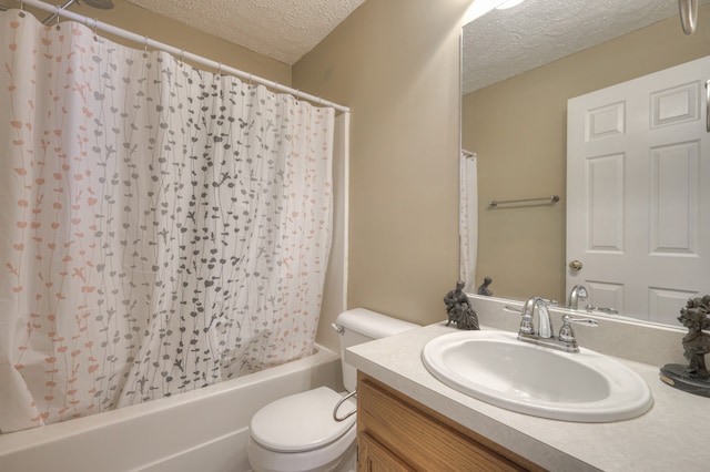 full bathroom with shower / tub combo, vanity, a textured ceiling, and toilet