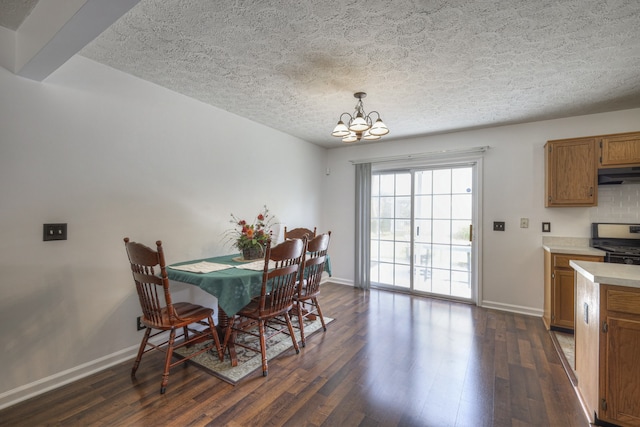 dining room with beam ceiling, a textured ceiling, dark hardwood / wood-style floors, and a notable chandelier