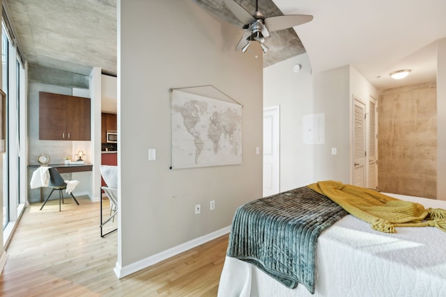 bedroom featuring a closet, ceiling fan, and light wood-type flooring