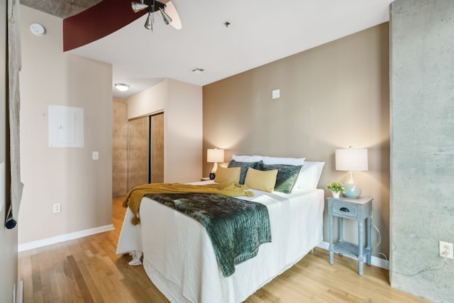 bedroom featuring light hardwood / wood-style flooring and a closet