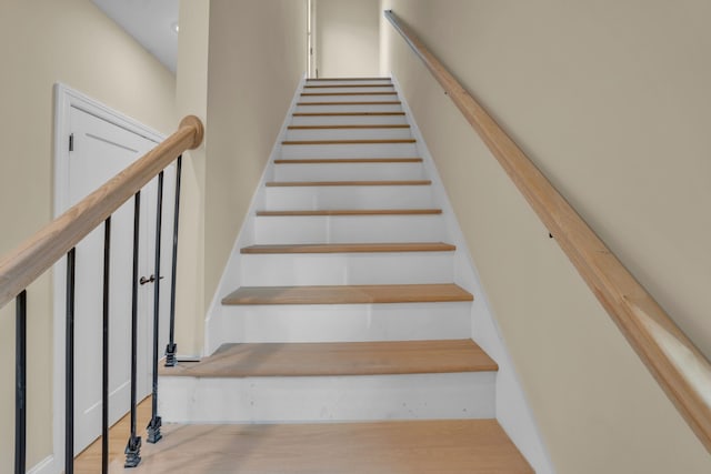 stairs with wood-type flooring