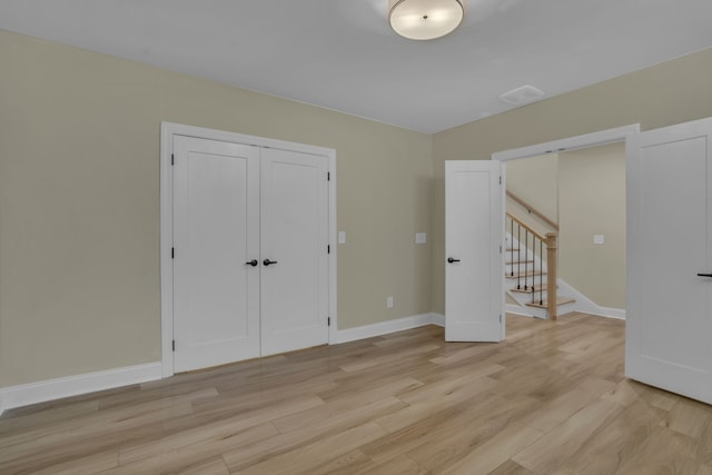 unfurnished room featuring light hardwood / wood-style flooring