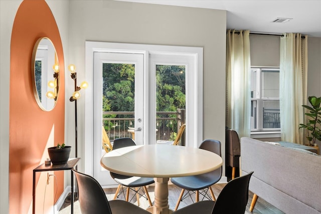 dining area featuring hardwood / wood-style floors and french doors