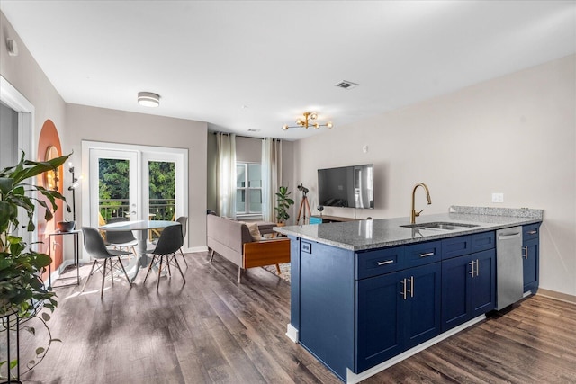 kitchen with stone countertops, dark hardwood / wood-style floors, kitchen peninsula, sink, and blue cabinetry