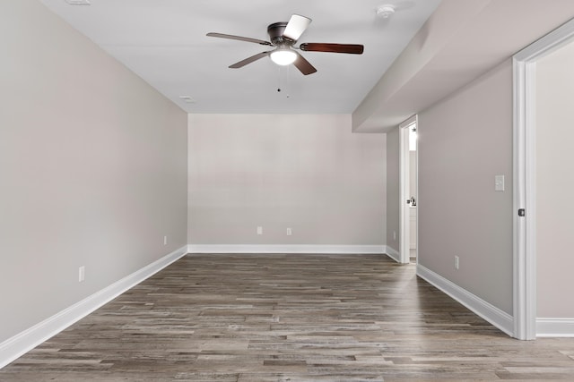 empty room featuring dark hardwood / wood-style floors and ceiling fan