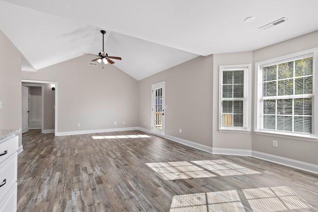 unfurnished living room featuring light hardwood / wood-style floors, vaulted ceiling, and ceiling fan