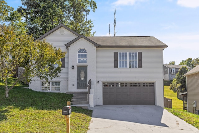 view of front facade with a front yard and a garage