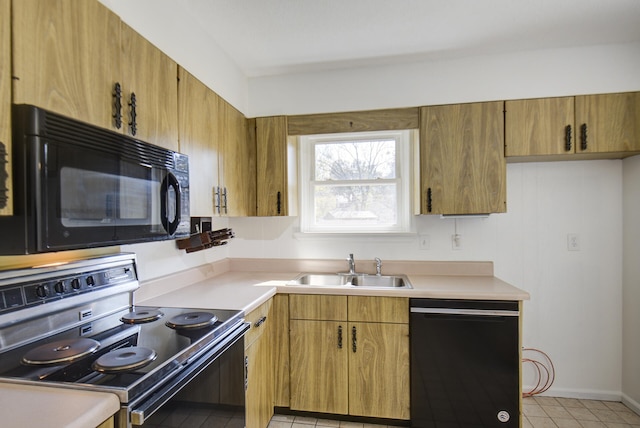 kitchen with sink, light tile patterned floors, and black appliances