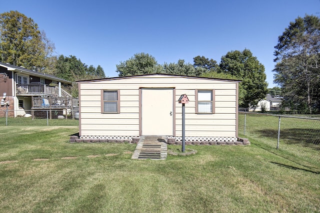 view of outbuilding featuring a yard