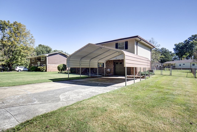 rear view of property featuring a carport and a lawn