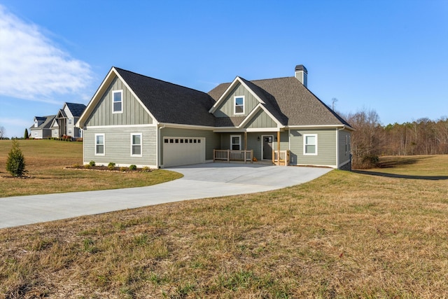 craftsman house featuring a front lawn and a garage