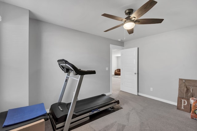 workout area featuring carpet flooring and ceiling fan