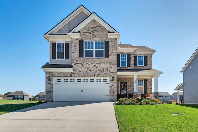 craftsman-style home with a garage and a front lawn