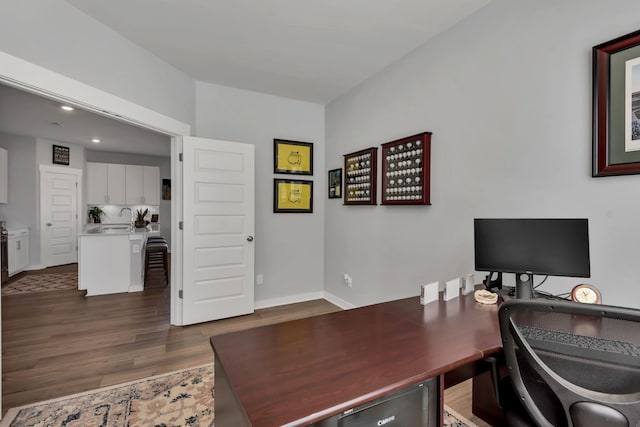 office with dark wood-type flooring