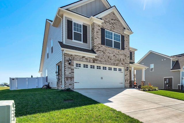 craftsman-style home with a garage and a front yard