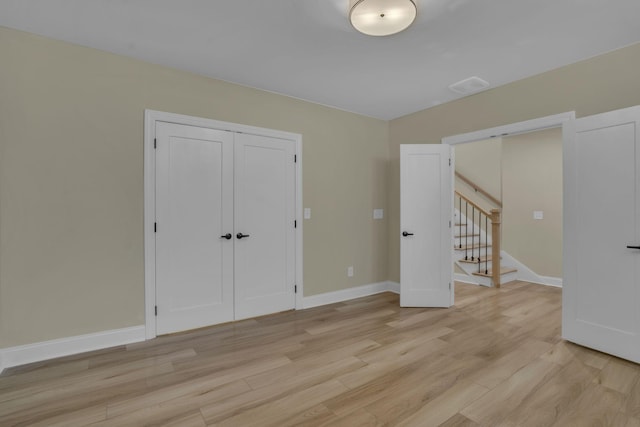 spare room featuring light wood-type flooring