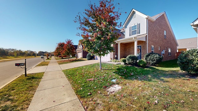 exterior space featuring a front lawn and a garage