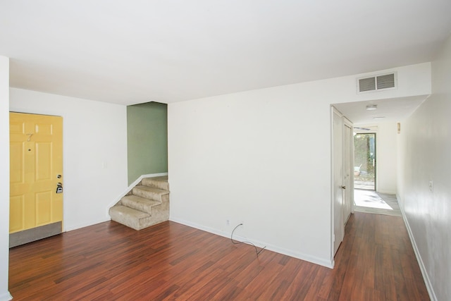 spare room featuring dark hardwood / wood-style flooring