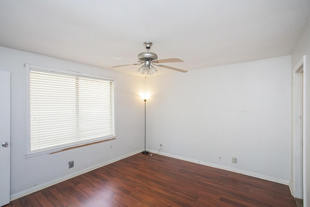 empty room featuring dark hardwood / wood-style floors and ceiling fan