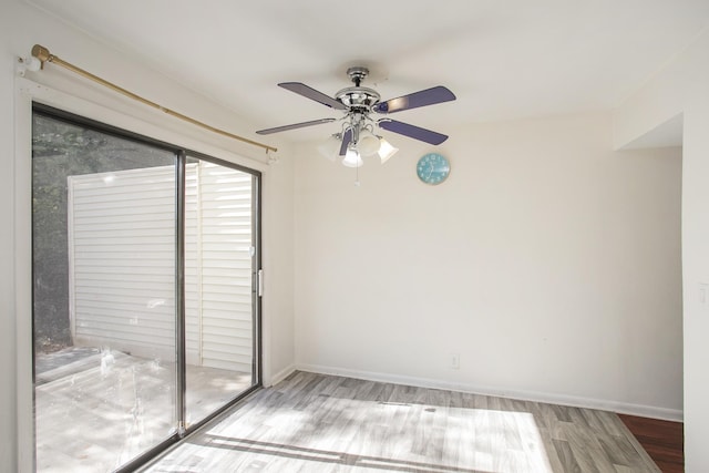 unfurnished room with ceiling fan and light wood-type flooring