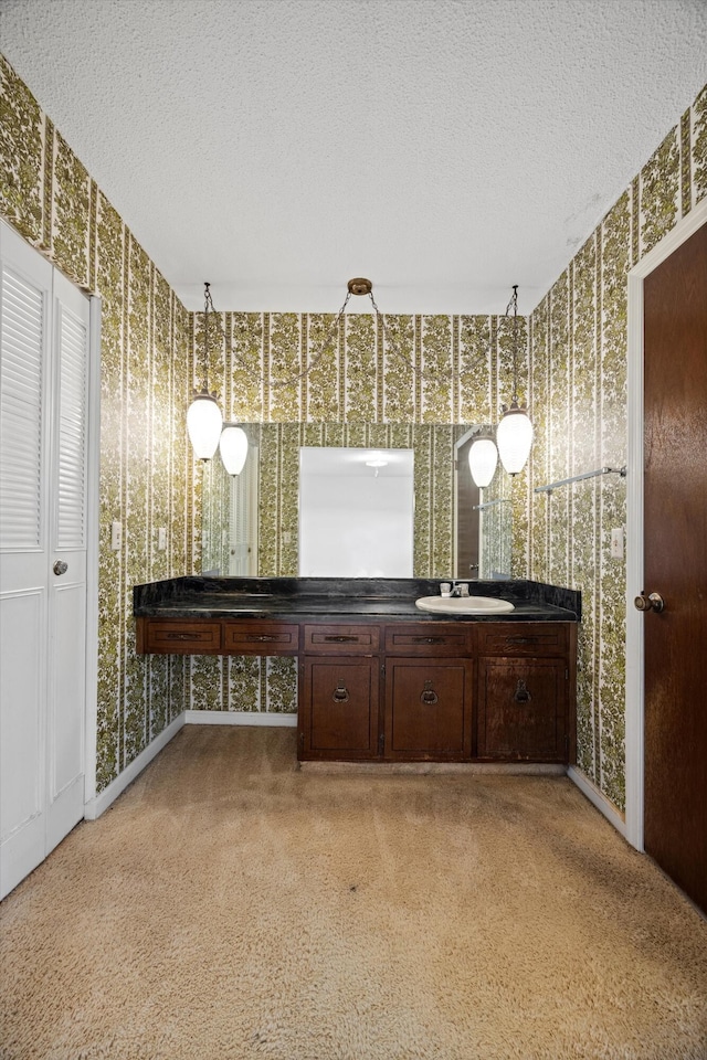 bathroom featuring vanity and a textured ceiling