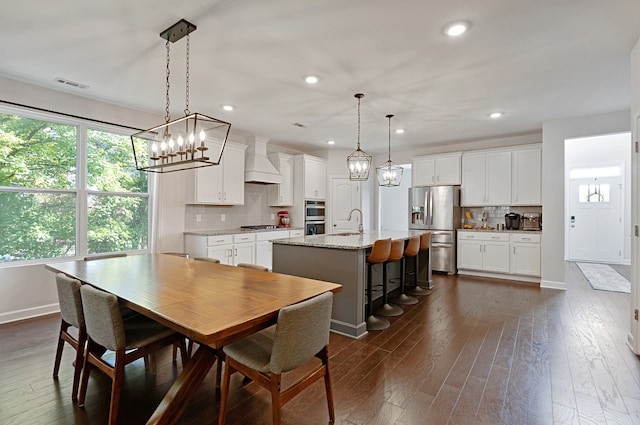 dining space with dark wood-type flooring and sink